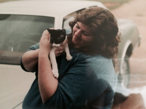 Me at age 21, wearing a man's sweatshirt. The kitty was Cagney. 
